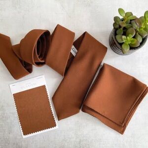 Men’s necktie and matching pocket square. Special order from the UK. Never worn.